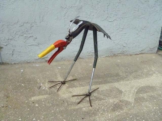 clipper head shovel bird yard art metal sculpture
